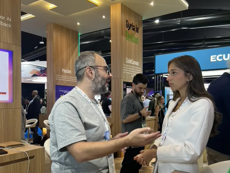Talking with a visitor at the SocialPin stand, GITEX Global
