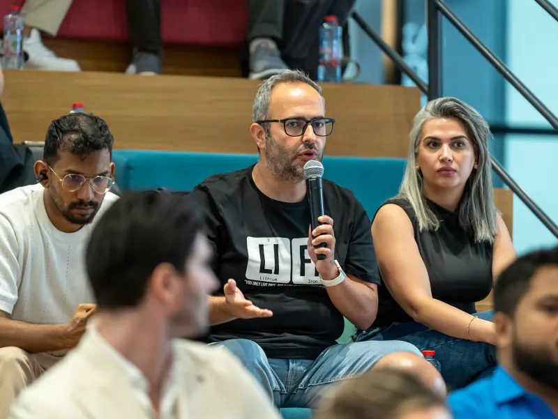 SocialPin founder speaking on a panel in Dubai